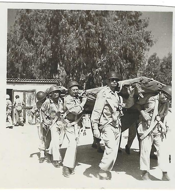 Jean in front Carrying the Parachute